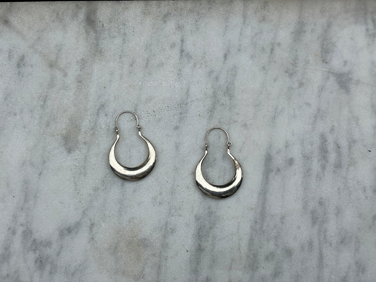 SANCROSANCT CRESCENT HOOP SILVER EARRINGS