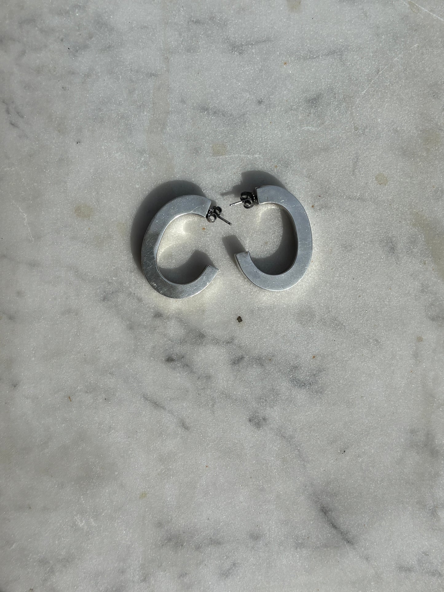 SACROSANCT LARGE SCULPTURAL HOOP EARRINGS